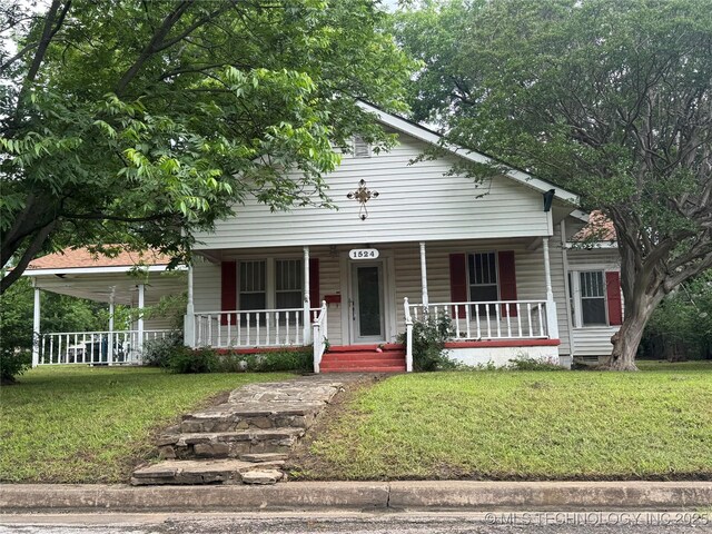 1524 W Maple St W, Durant, OK 74701 - view of front of property featuring covered porch and a front yard
