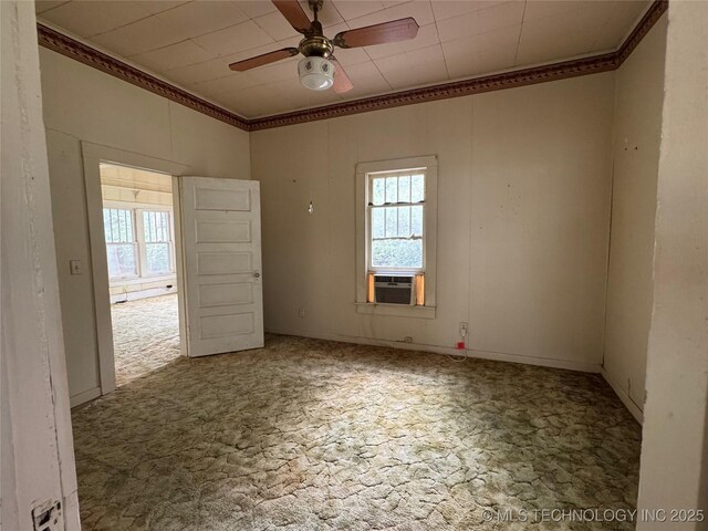 1524 W Maple St W, Durant, OK 74701 - empty room featuring plenty of natural light, ornamental molding, ceiling fan, and cooling unit