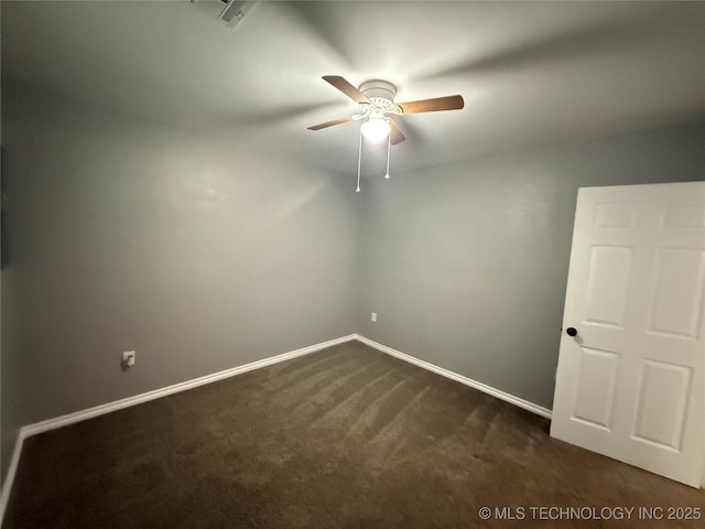 1618 Houston St, Muskogee, OK 74403 - empty room with dark colored carpet, a ceiling fan, and baseboards