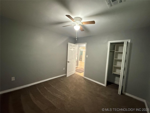 1618 Houston St, Muskogee, OK 74403 - unfurnished bedroom with dark carpet, baseboards, a ceiling fan, and a closet