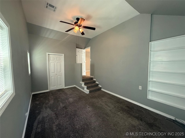1618 Houston St, Muskogee, OK 74403 - unfurnished bedroom featuring lofted ceiling, baseboards, carpet, and ceiling fan