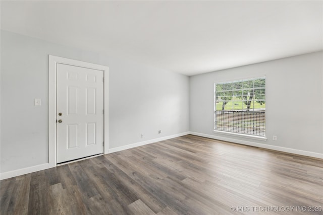 4440 68th St Unit 486, Tulsa, OK 74136 - unfurnished room with wood finished floors and baseboards