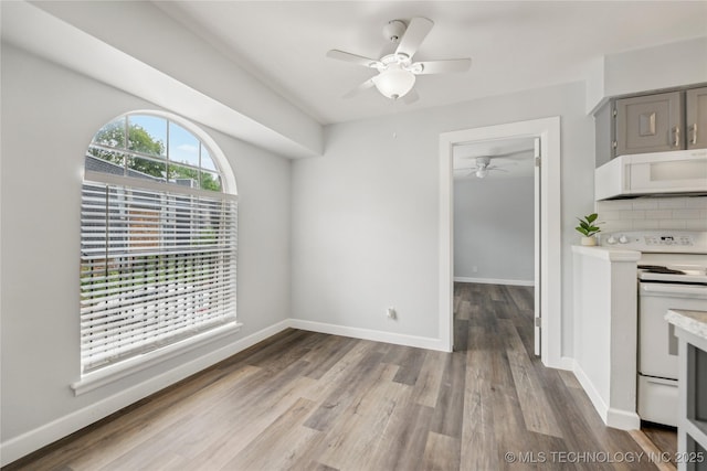 4440 68th St Unit 486, Tulsa, OK 74136 - kitchen with white appliances, gray cabinets, a ceiling fan, light countertops, and wood finished floors