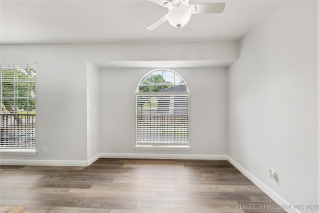 4440 68th St Unit 486, Tulsa, OK 74136 - spare room featuring plenty of natural light, a ceiling fan, and baseboards