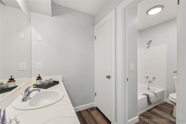4440 68th St Unit 486, Tulsa, OK 74136 - full bath with toilet, wood finished floors, shower / washtub combination, and vanity
