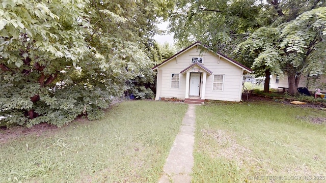 134 E Federal St, Drumright, OK 74030 - bungalow-style house featuring a front yard