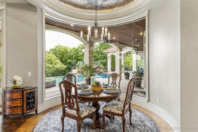 5879 N Eagle Summit Rd, Owasso, OK 74055 - dining area featuring a chandelier and baseboards