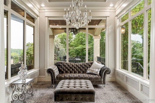 5879 N Eagle Summit Rd, Owasso, OK 74055 - sunroom / solarium with plenty of natural light, a chandelier, and crown molding
