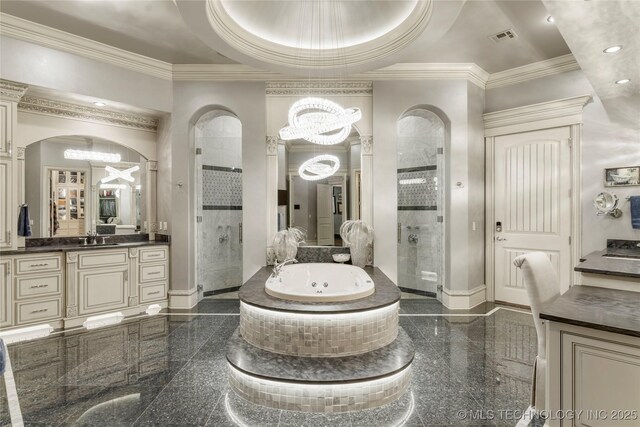 5879 N Eagle Summit Rd, Owasso, OK 74055 - full bath featuring a chandelier, a stall shower, granite tiled floors, a tub with jets, and crown molding