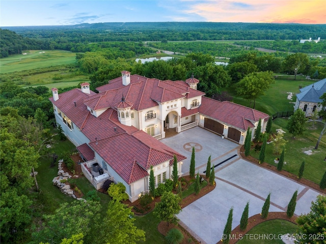 5879 N Eagle Summit Rd, Owasso, OK 74055 - view of subject property with a nearby body of water and a forest