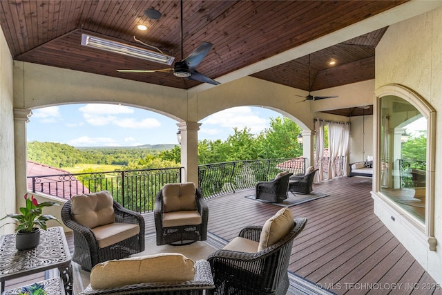 5879 N Eagle Summit Rd, Owasso, OK 74055 - wooden deck featuring a ceiling fan and a forest view