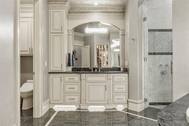 5879 N Eagle Summit Rd, Owasso, OK 74055 - full bath featuring a stall shower, vanity, toilet, inlaid floor details, and ornamental molding
