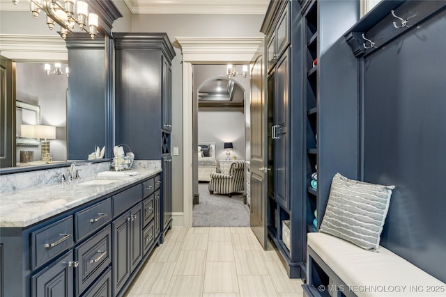 5879 N Eagle Summit Rd, Owasso, OK 74055 - full bath featuring vanity, a chandelier, crown molding, and connected bathroom