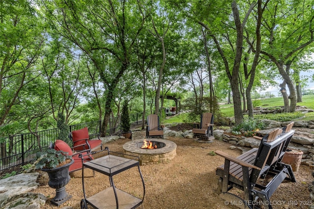 5879 N Eagle Summit Rd, Owasso, OK 74055 - view of yard with an outdoor fire pit