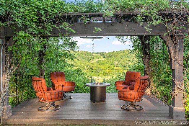 5879 N Eagle Summit Rd, Owasso, OK 74055 - wooden terrace featuring a forest view