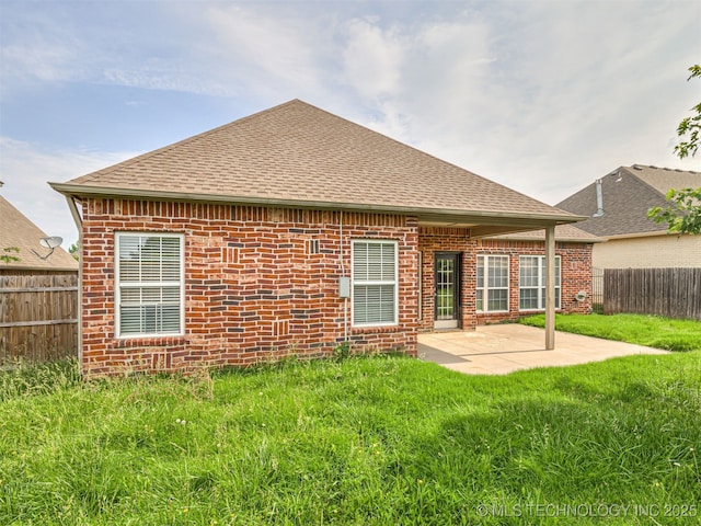 4610 E 142nd St S, Bixby, OK 74008 - back of property with a fenced backyard, roof with shingles, a patio, and brick siding