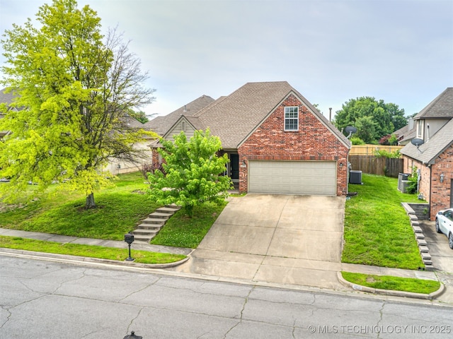 4610 E 142nd St S, Bixby, OK 74008 - traditional-style home with driveway, brick siding, roof with shingles, and an attached garage
