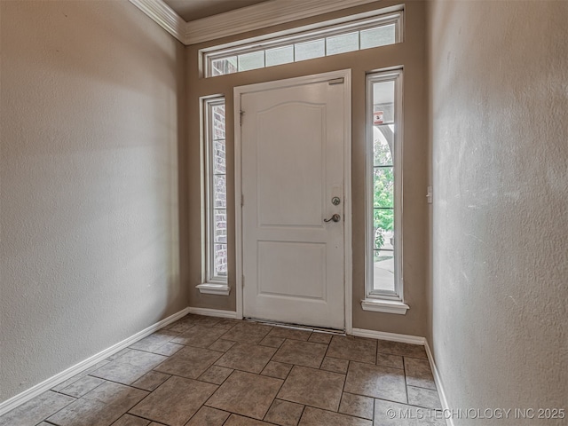 4610 E 142nd St S, Bixby, OK 74008 - entrance foyer with a textured wall, plenty of natural light, stone finish flooring, and crown molding