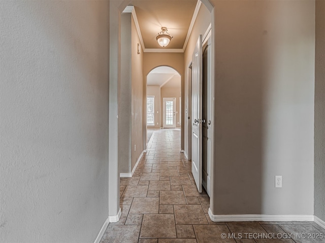 4610 E 142nd St S, Bixby, OK 74008 - corridor with arched walkways, stone tile floors, ornamental molding, and a textured wall