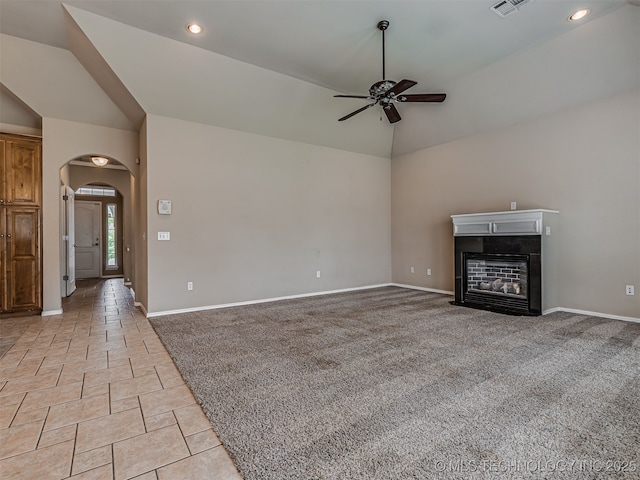 4610 E 142nd St S, Bixby, OK 74008 - unfurnished living room with lofted ceiling, a ceiling fan, arched walkways, a fireplace with flush hearth, and recessed lighting