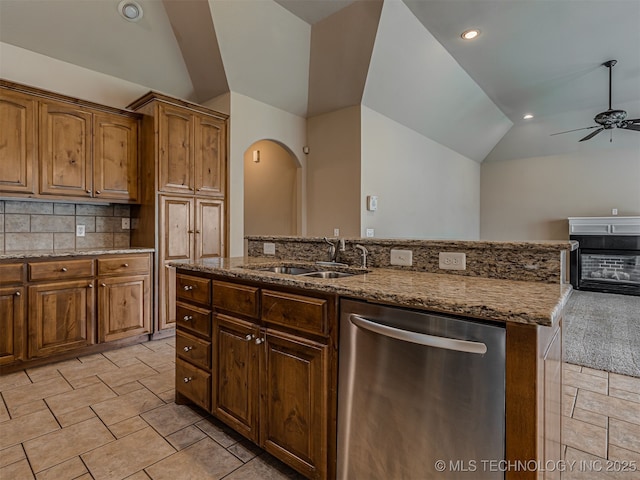 4610 E 142nd St S, Bixby, OK 74008 - kitchen featuring stainless steel dishwasher, lofted ceiling, light stone countertops, a ceiling fan, and open floor plan