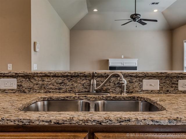4610 E 142nd St S, Bixby, OK 74008 - kitchen view of light stone countertops, a ceiling fan, and recessed lighting