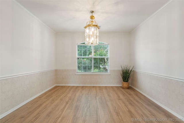 5202 Greenan Dr, Sand Springs, OK 74063 - spare room featuring wood finished floors, a chandelier, crown molding, and baseboards