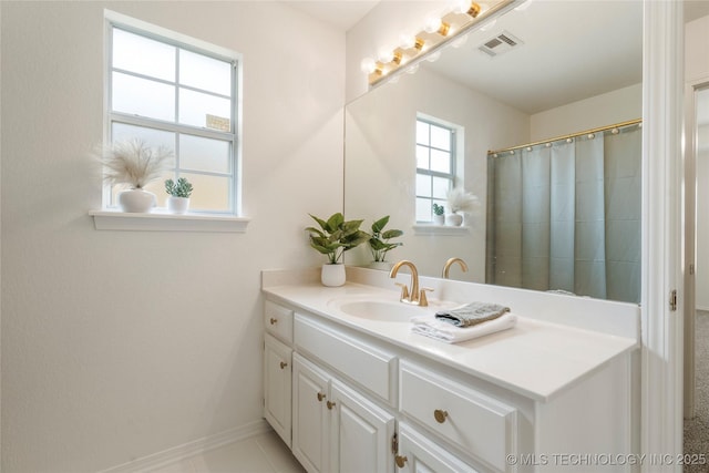5202 Greenan Dr, Sand Springs, OK 74063 - bathroom with vanity, baseboards, and curtained shower
