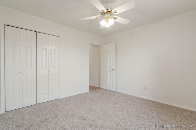 5202 Greenan Dr, Sand Springs, OK 74063 - unfurnished bedroom with carpet, a closet, baseboards, and a ceiling fan