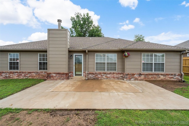 5202 Greenan Dr, Sand Springs, OK 74063 - back of house with brick siding, a patio, and a chimney