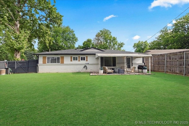 1008 E 54th St S, Tulsa, OK 74105 - back of property with brick siding and a patio