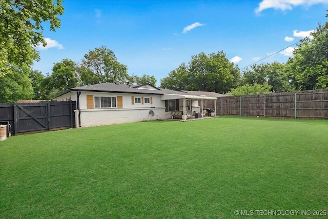 1008 E 54th St S, Tulsa, OK 74105 - rear view of house with brick siding and a patio area