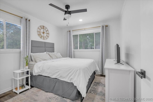 1008 E 54th St S, Tulsa, OK 74105 - bedroom featuring wood finished floors, baseboards, and a ceiling fan