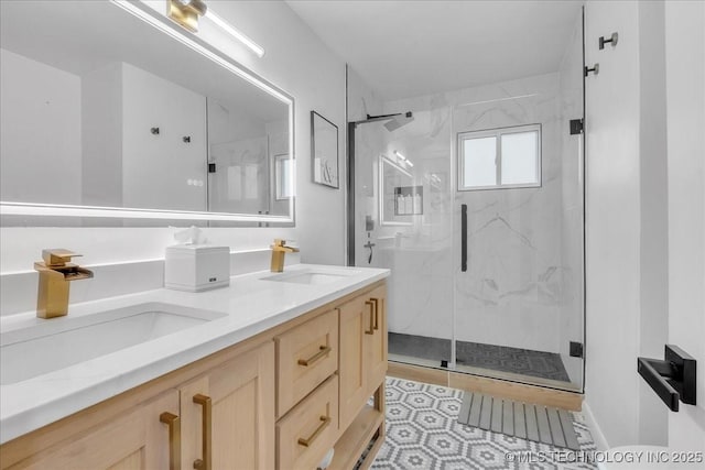 1008 E 54th St S, Tulsa, OK 74105 - full bath with a marble finish shower, double vanity, and tile patterned flooring
