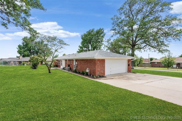 911 S Boyd Pl, Sapulpa, OK 74066 - view of front of house with brick siding, a front lawn, driveway, and a garage
