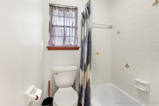 911 S Boyd Pl, Sapulpa, OK 74066 - bathroom featuring toilet and shower / bathtub combination with curtain