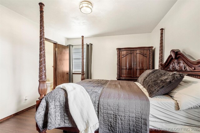 911 S Boyd Pl, Sapulpa, OK 74066 - bedroom featuring wood finished floors and baseboards