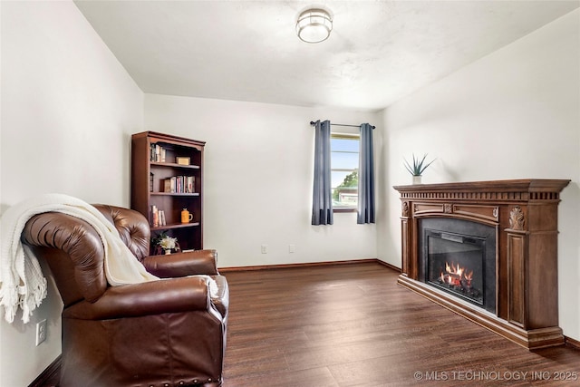 911 S Boyd Pl, Sapulpa, OK 74066 - sitting room featuring dark wood-style floors, a glass covered fireplace, and baseboards
