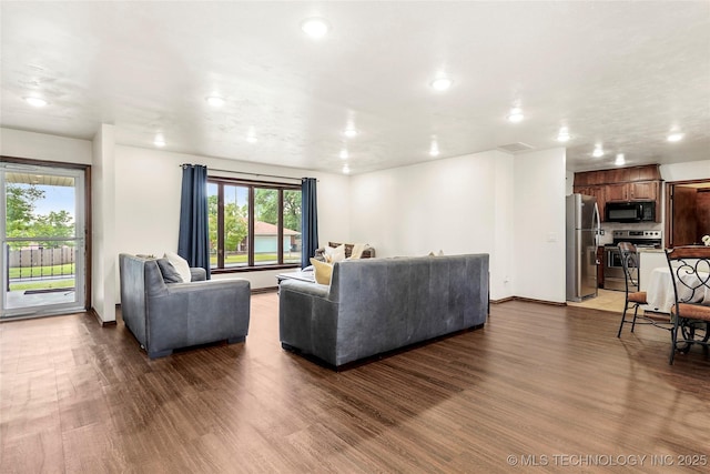 911 S Boyd Pl, Sapulpa, OK 74066 - living area featuring recessed lighting, wood finished floors, and baseboards