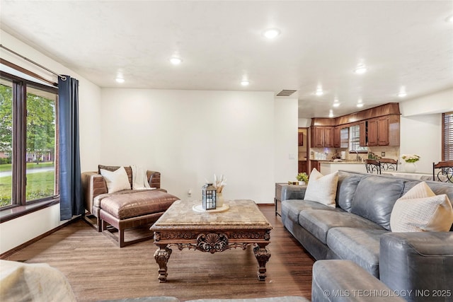 911 S Boyd Pl, Sapulpa, OK 74066 - living room with wood finished floors, plenty of natural light, baseboards, and recessed lighting