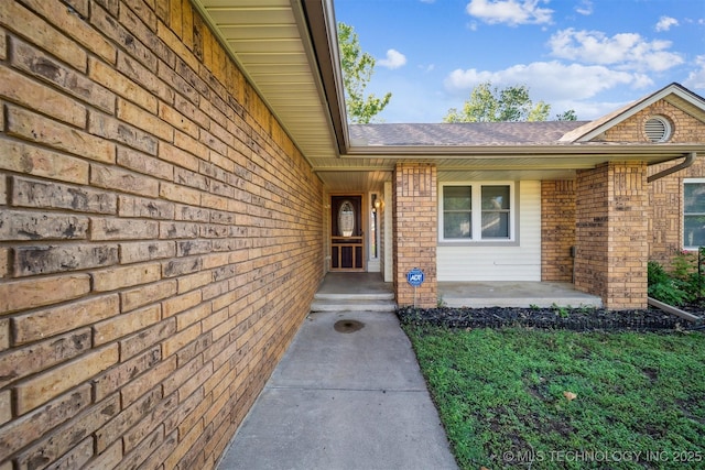 9703 N 109th E Ave, Owasso, OK 74055 - property entrance with brick siding and roof with shingles