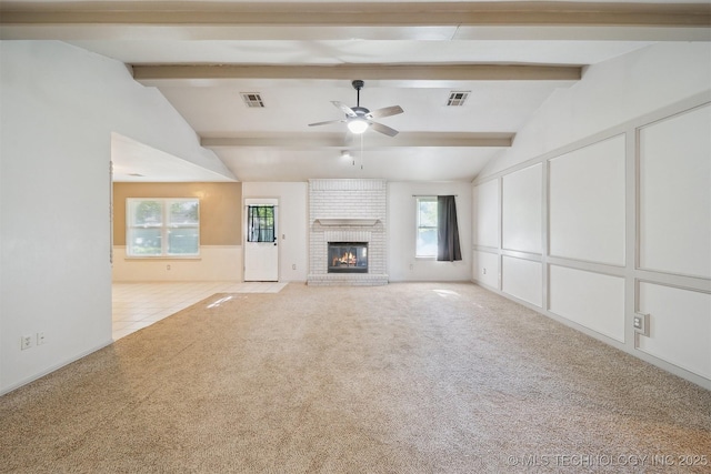 9703 N 109th E Ave, Owasso, OK 74055 - unfurnished living room featuring carpet, ceiling fan, a fireplace, and tile patterned floors