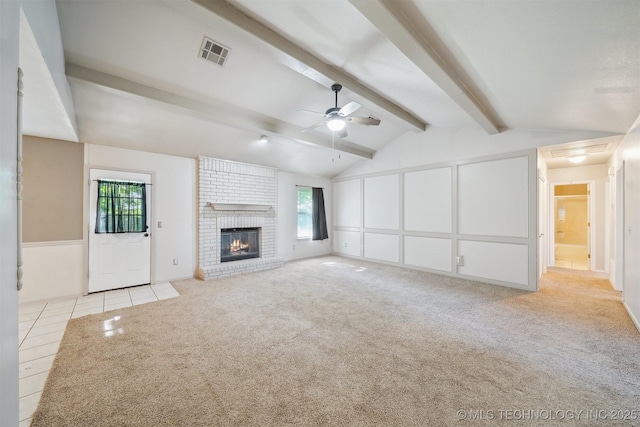 9703 N 109th E Ave, Owasso, OK 74055 - unfurnished living room featuring healthy amount of natural light, a ceiling fan, light carpet, and a brick fireplace