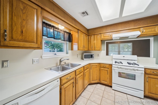 9703 N 109th E Ave, Owasso, OK 74055 - kitchen with white appliances, under cabinet range hood, a sink, and light countertops