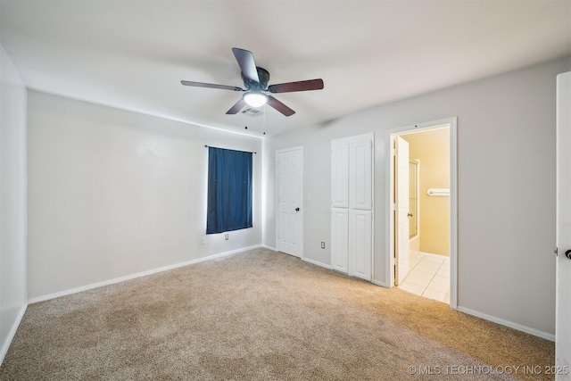 9703 N 109th E Ave, Owasso, OK 74055 - unfurnished bedroom featuring carpet flooring, ensuite bath, two closets, and baseboards
