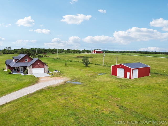 5757 W 181st St S, Mounds, OK 74047 - view of grassy yard with driveway, a rural view, a detached garage, an outbuilding, and an outdoor structure