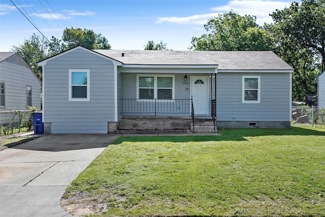 821 N 71st E Ave, Tulsa, OK 74115 - view of front facade featuring covered porch and driveway
