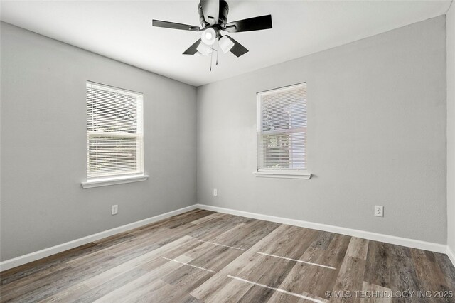 821 N 71st E Ave, Tulsa, OK 74115 - spare room with wood finished floors, baseboards, and a ceiling fan