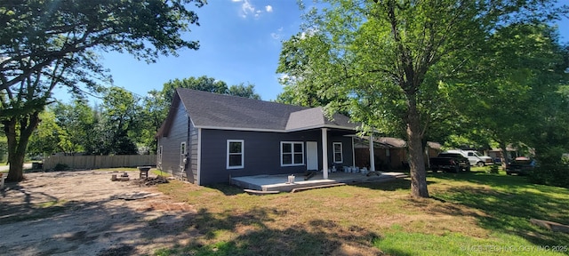 510 S Madison Ave, Wagoner, OK 74467 - view of front of home with a shingled roof and a wooden deck
