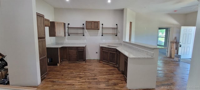 510 S Madison Ave, Wagoner, OK 74467 - kitchen featuring a peninsula, dark wood-style flooring, light stone countertops, a ceiling fan, and recessed lighting